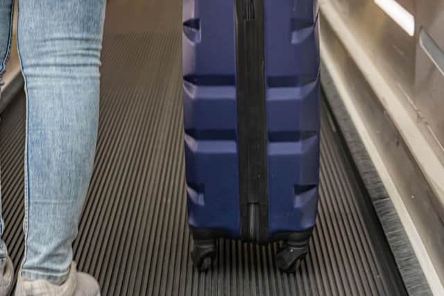 Carry-on luggage will safe stress all round but means you have to pack less so space-saving hacks are key. Pic: PA Photo/Alamy.