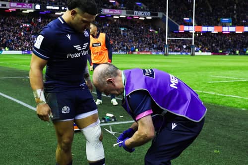 Dr James Robson attends to Scotland centre Sione Tuipulotu's knee injury during the Guinness Six Nations match against England at Scottish Gas Murrayfield on February 24, 2024. (Photo by Ross MacDonald / SNS Group)