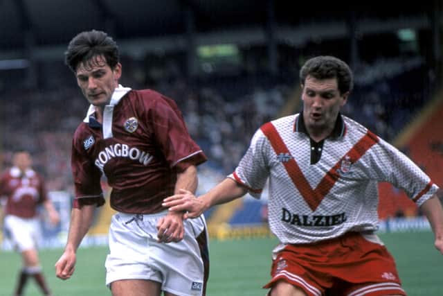 Airdire defender Sandy Stewart (right) is shadowed by Craig Levein of Hearts during a Scottish Cup semi-final in 1994.