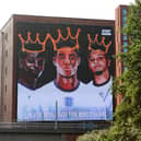 A giant mural in support of three England footballers Marcus Rashford, Jadon Sancho and Bukayo Saka has been unveiled in Manchester after the England stars were targeted with racist abuse online (Getty).