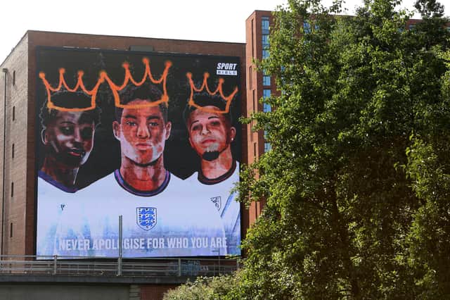 A giant mural in support of three England footballers Marcus Rashford, Jadon Sancho and Bukayo Saka has been unveiled in Manchester after the England stars were targeted with racist abuse online (Getty).