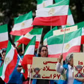 Protesters wave Iranian opposition flags and hold banners during a demonstration organised by supporters of the National Council of Resistance of Iran (NCRI) to protest against the inauguration of Iran's president Ebrahim Raisi outside Downing Street in London last year.