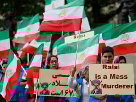 Protesters wave Iranian opposition flags and hold banners during a demonstration organised by supporters of the National Council of Resistance of Iran (NCRI) to protest against the inauguration of Iran's president Ebrahim Raisi outside Downing Street in London last year.