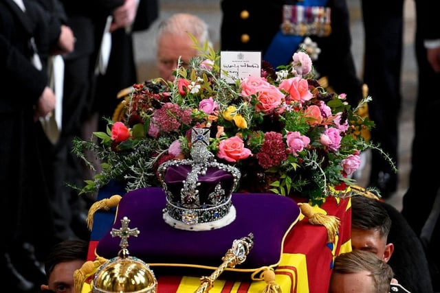 LONDON, ENGLAND - SEPTEMBER 19: King Charles III walks alongside the coffin carrying Queen Elizabeth II with the Imperial State Crown resting on top as it departs Westminster Abbey during the State Funeral of Queen Elizabeth II on September 19, 2022 in London, England. Elizabeth Alexandra Mary Windsor was born in Bruton Street, Mayfair, London on 21 April 1926. She married Prince Philip in 1947 and ascended the throne of the United Kingdom and Commonwealth on 6 February 1952 after the death of her Father, King George VI. Queen Elizabeth II died at Balmoral Castle in Scotland on September 8, 2022, and is succeeded by her eldest son, King Charles III.  (Photo by Gareth Cattermole/Getty Images)
