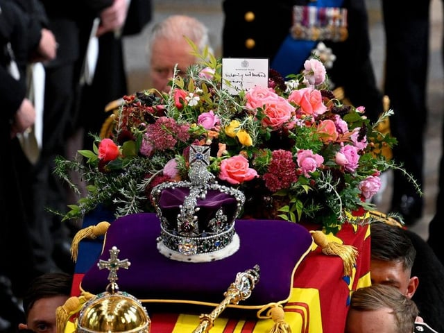 LONDON, ENGLAND - SEPTEMBER 19: King Charles III walks alongside the coffin carrying Queen Elizabeth II with the Imperial State Crown resting on top as it departs Westminster Abbey during the State Funeral of Queen Elizabeth II on September 19, 2022 in London, England. Elizabeth Alexandra Mary Windsor was born in Bruton Street, Mayfair, London on 21 April 1926. She married Prince Philip in 1947 and ascended the throne of the United Kingdom and Commonwealth on 6 February 1952 after the death of her Father, King George VI. Queen Elizabeth II died at Balmoral Castle in Scotland on September 8, 2022, and is succeeded by her eldest son, King Charles III.  (Photo by Gareth Cattermole/Getty Images)