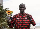 Gold medallist Eliud Kipchoge celebrates after the men's marathon final
