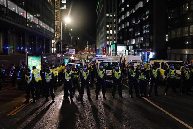 Police officers on St Vincent Street, Glasgow, as members of Extinction Rebellion protest outside a branch of Santander. Picture date: Tuesday November 9, 2021. PA Photo. See PA story ENVIRONMENT Cop26. Photo credit should read: Andrew Milligan/PA Wire