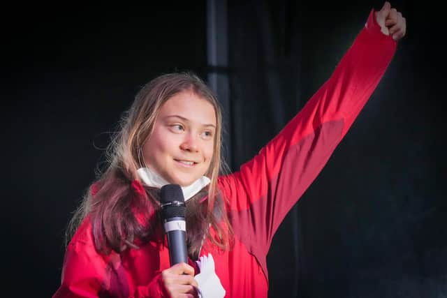 GLASGOW, SCOTLAND - NOVEMBER 05: Climate activist Greta Thunberg speaks at a the "Fridays For Future" climate rally during COP26 on November 5, 2021 in Glasgow, Scotland. Day Six of the 2021 climate summit in Glasgow will focus on youth and public empowerment. Outside the COP26 site, on the streets of Glasgow, the "Fridays For Future" youth climate movement hold a march to George Square in the centre of Glasgow where popular youth activists will address the crowd. The 26th "Conference of the Parties" and represents a gathering of all the countries signed on to the U.N. Framework Convention on Climate Change and the Paris Climate Agreement. The aim of this year's conference is to commit countries to net-zero carbon emissions by 2050. (Photo by Christopher Furlong/Getty Images)
