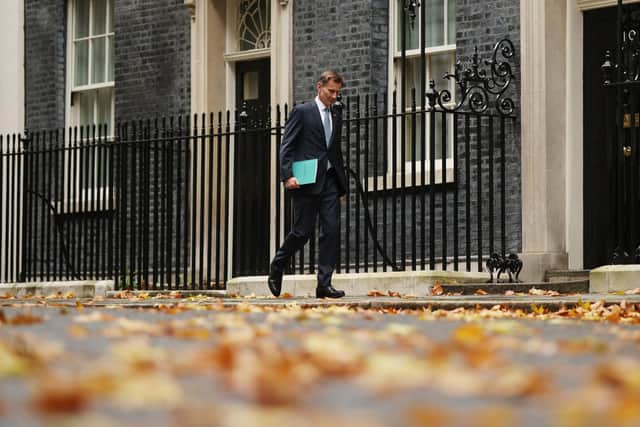 Chancellor Jeremy Hunt leaves Downing Street on his way to present the autumn statement to the Commons (Picture: Dan Kitwood/Getty Images)