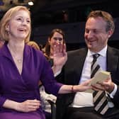 Liz Truss with her husband Hugh O'Leary, at the Queen Elizabeth II Centre in London as it was announced that she is the new Conservative party leader, and will become the next Prime Minister.