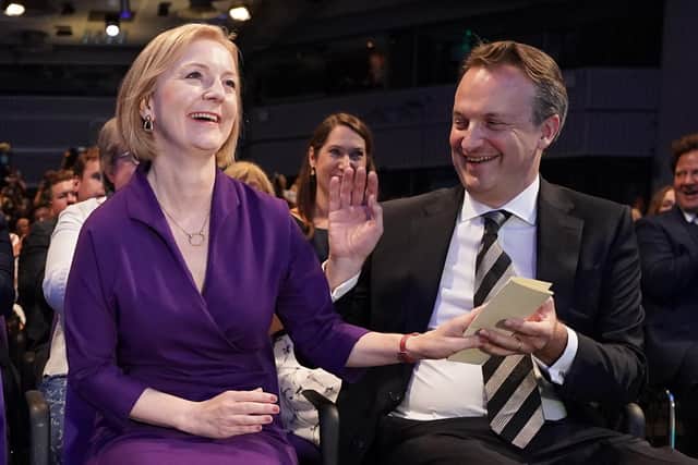 Liz Truss with her husband Hugh O'Leary, at the Queen Elizabeth II Centre in London as it was announced that she is the new Conservative party leader, and will become the next Prime Minister.
