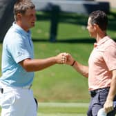Bryson DeChambeau and Rory McIlroy bump fists during last year's Charles Schwab Challenge in Fort Worth, Texas. Picture: Tom Pennington/Getty Images.
