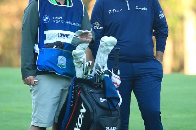 Shane Lowry and caddie Bo Martin talk tactics during the second round of the BMW PGA Championship at Wentworth. Picture: Andrew Redington/Getty Images