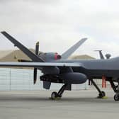 A U.S. MQ-9 drone is on display during an air show at Kandahar Airfield, Afghanistan, Tuesday, Jan. 23, 2018 .A Russian fighter jet downed a US drone operating over the Black Sea on Tuesday, with each nation blaming the other, and tensions heightened around the incident.  (AP Photo/Massoud Hossaini, File)