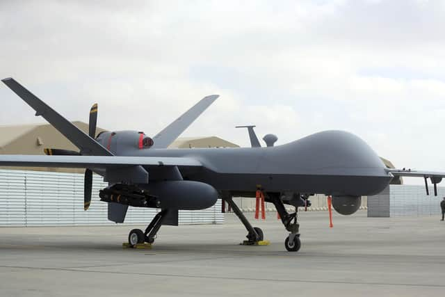 A U.S. MQ-9 drone is on display during an air show at Kandahar Airfield, Afghanistan, Tuesday, Jan. 23, 2018 .A Russian fighter jet downed a US drone operating over the Black Sea on Tuesday, with each nation blaming the other, and tensions heightened around the incident.  (AP Photo/Massoud Hossaini, File)