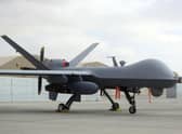 A U.S. MQ-9 drone is on display during an air show at Kandahar Airfield, Afghanistan, Tuesday, Jan. 23, 2018 .A Russian fighter jet downed a US drone operating over the Black Sea on Tuesday, with each nation blaming the other, and tensions heightened around the incident.  (AP Photo/Massoud Hossaini, File)