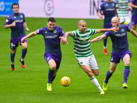 David Gray and Paul Hanlon keep tabs on Patryk Klimala during the pre-season friendly between Celtic and Hibs at Celtic Park