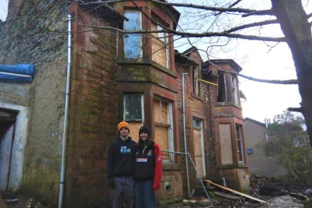 Cal and Claire outside the Victorian villa they bought by accident. Pic: whathavewedunoon.co.uk