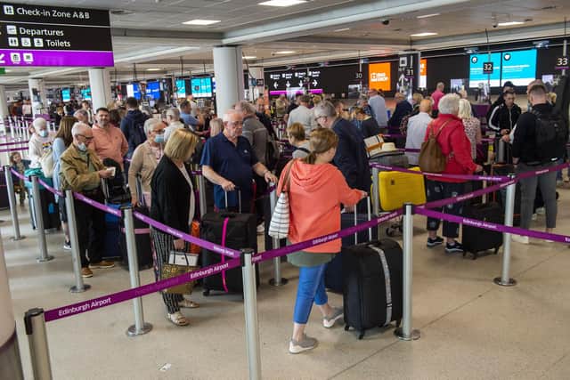 Baggage drop-off queues have lengthened due to passengers arriving too early for flights. Picture: Lisa Ferguson