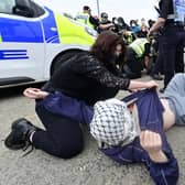 Police and pro-Palestinian protesters clash during a demonstration outside the entrance to a military electronics factory in Glasgow. Picture: John Devlin