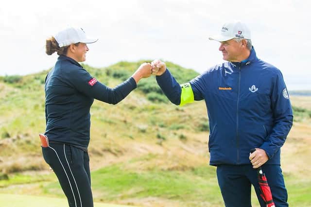 Michele Thomson earns a fist bump from her manager Paul Lawrie after carding a seven-under-par 65 in the first round of the Trust Golf Women's Scottish Open at Dumbarnie Links. Picture: Tristan Jones/LET