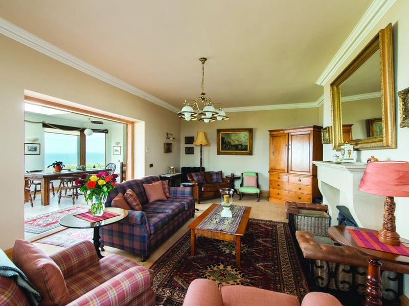 The property also has a cosy drawing room with limestone fireplace housing a wood-burning stove. A glazed sun room, added by the previous owners, is currently used as a games room with a snooker table as its focal piece.