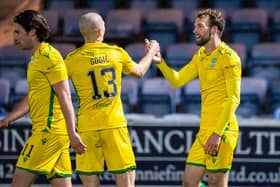 Christian Doidge, far right, scored twice for Hibs at Queen of the South.