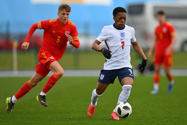 Karamoko Dembele of England tracked by Tom Davies of Wales during the International Friendly match between Wales U18 and England U18 at Leckwith Stadium on March 29, 2021 in Cardiff, Wales. (Photo by Dan Mullan/Getty Images)