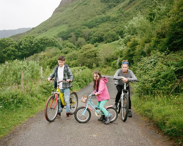 Brother and sisters on bikes on Eigg. Photographer Danny North immersed himself in island life for his series As I Found Her with a number of photographs set to be acquired by Scottish National Portrait Gallery. PIC: Danny North.