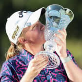 Gemma Dryburgh kisses the trophy following her victory the TOTO Japan Classic on the LPGA Tour in November. Picture: STR/JIJI Press/AFP via Getty Images.