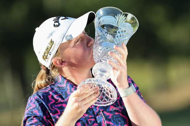 Gemma Dryburgh kisses the trophy following her victory the TOTO Japan Classic on the LPGA Tour in November. Picture: STR/JIJI Press/AFP via Getty Images.