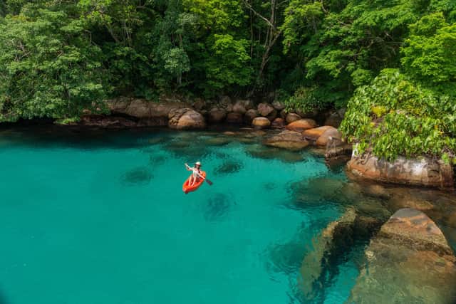 Paddling in the clear waters of Paraty. Pic: PA Photo/Alamy.