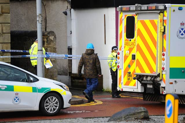 An area between Grahams Road Dental Surgery and Marley's Artisan Chocolates has been taped off.