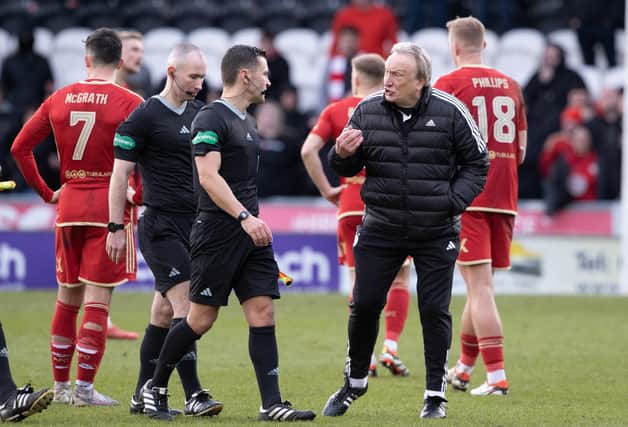 Aberdeen manager Neil Warnock speaks to referee Nick Walsh after the 2-1 defeat at St Mirren. (Photo by Alan Harvey / SNS Group)