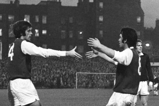 Hibs defender Pat Stanton (left) praises goal hero Jimmy O'Rourke after scoring the opening strike against Hearts in 1973.