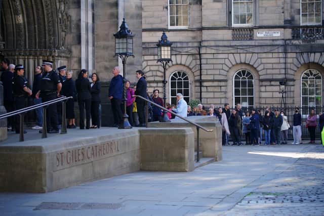 Members of the public queue to pay their respects to the Queen as she lies at rest at St Giles' Cathedral