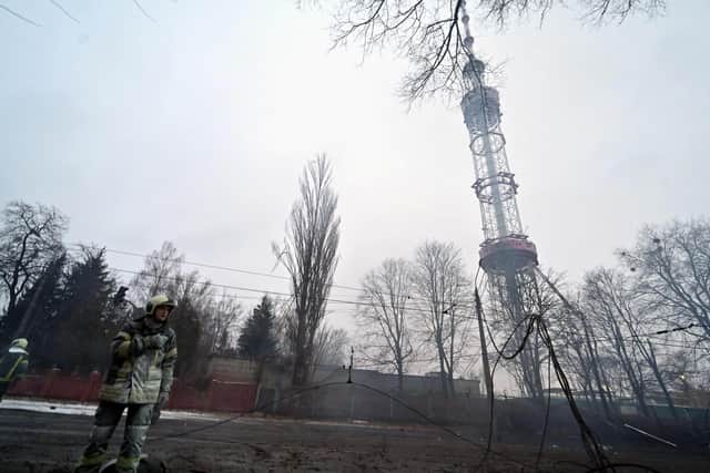 A fireman walks after Russian airstrike hit Kyiv's main television tower. Picture: Sergei Supinsky/AFP via Getty Images