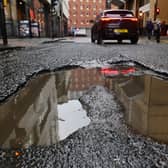Potholes are a regular source of complaint for drivers on Scotland's roads (Picture: John Devlin)