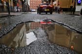 Potholes are a regular source of complaint for drivers on Scotland's roads (Picture: John Devlin)