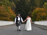 Newlyweds Magdalena Gordon and Iain Gordon walk across Gordon Bridge at Linn of Tummel near Pitlochry. Pictures: John Devlin.