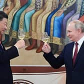 The murderous Vladimir Putin and Winnie the Pooh-lookalike Xi Jinping toast each other during a reception in March this year (Picture: Pavel Byrkin/Sputnik/AFP via Getty Images)