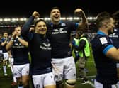 Grant Gilchrist, right, and Sione Tuipulotu celebrate the win over Wales at Murrayfield. (Photo by Craig Williamson / SNS Group)