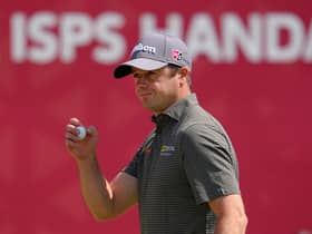 David Law acknowledges the crowd after finishing his third round with a birdie in the ISPS Handa Championship at PGM Ishioka GC in Japan. Picture: Yoshimasa Nakano/Getty Images.