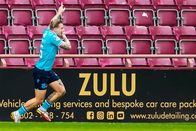 Jason Cummings celebrates his goal against Hearts.
