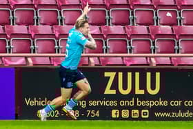 Jason Cummings celebrates his goal against Hearts.
