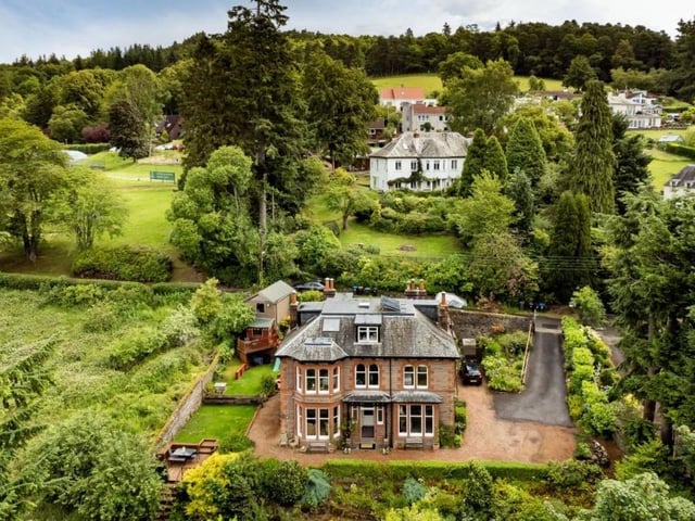 Aerial view of house and gardens.