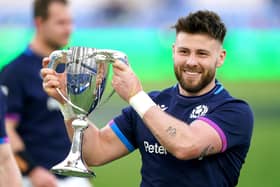 Scotland's Ali Price celebrates with the Cuttitta Cup after the Guinness Six Nations match at Stadio Olimpico, Rome.
