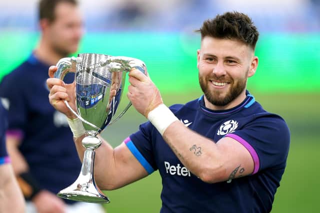 Scotland's Ali Price celebrates with the Cuttitta Cup after the Guinness Six Nations match at Stadio Olimpico, Rome.