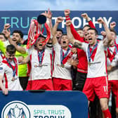 Airdrie captain Adam Frizzell lifts the SPFL Trust Trophy after the 2-1 victory over TNS at the Falkirk Stadium. (Photo by Craig Foy / SNS Group)