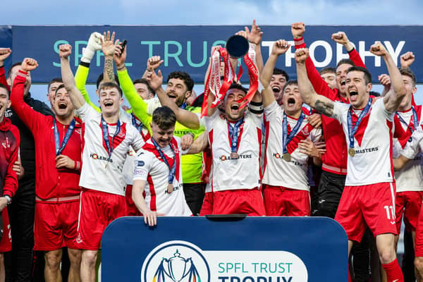 Airdrie captain Adam Frizzell lifts the SPFL Trust Trophy after the 2-1 victory over TNS at the Falkirk Stadium. (Photo by Craig Foy / SNS Group)